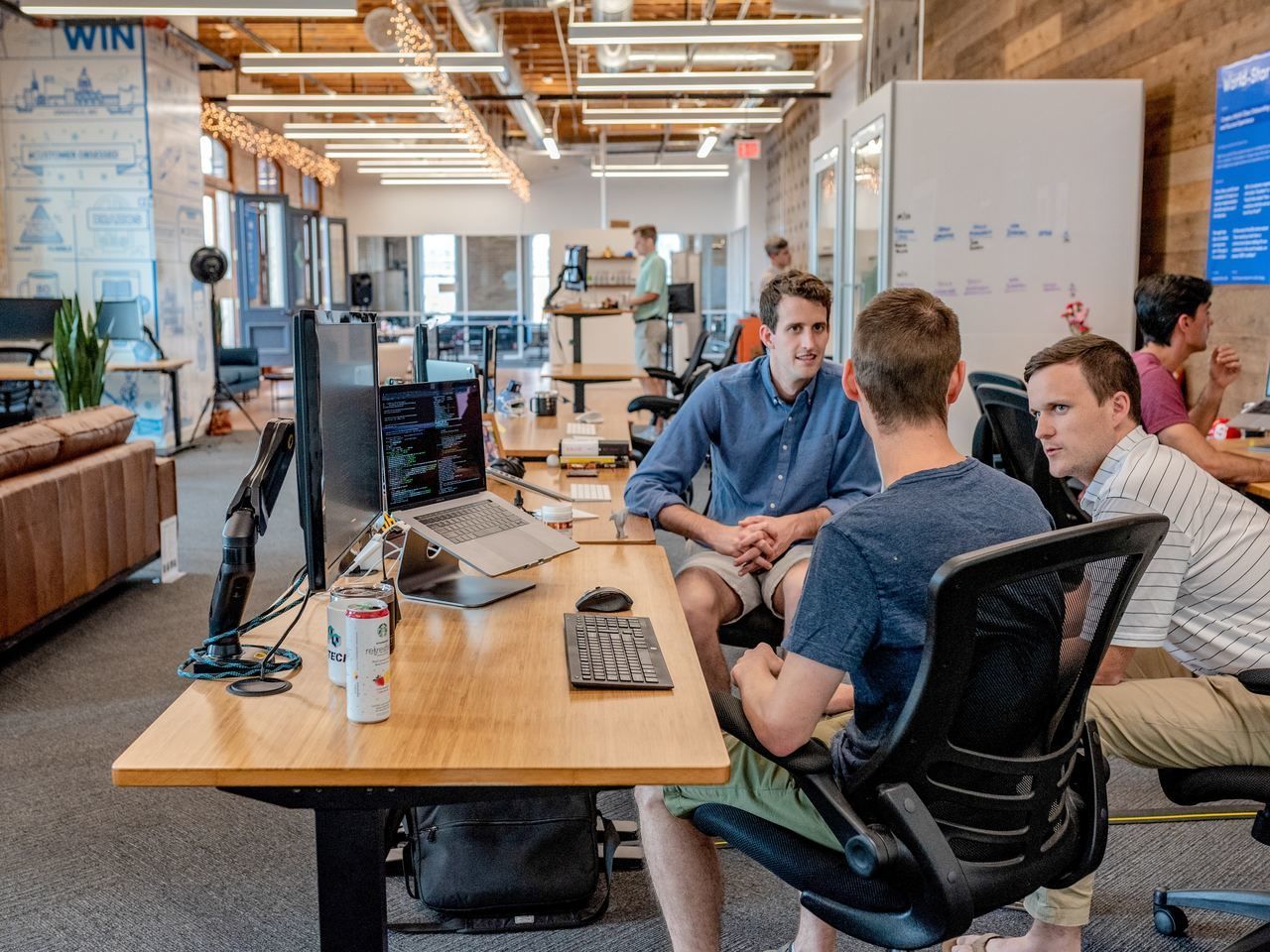 three men discussing about an issue related to their work and strategy