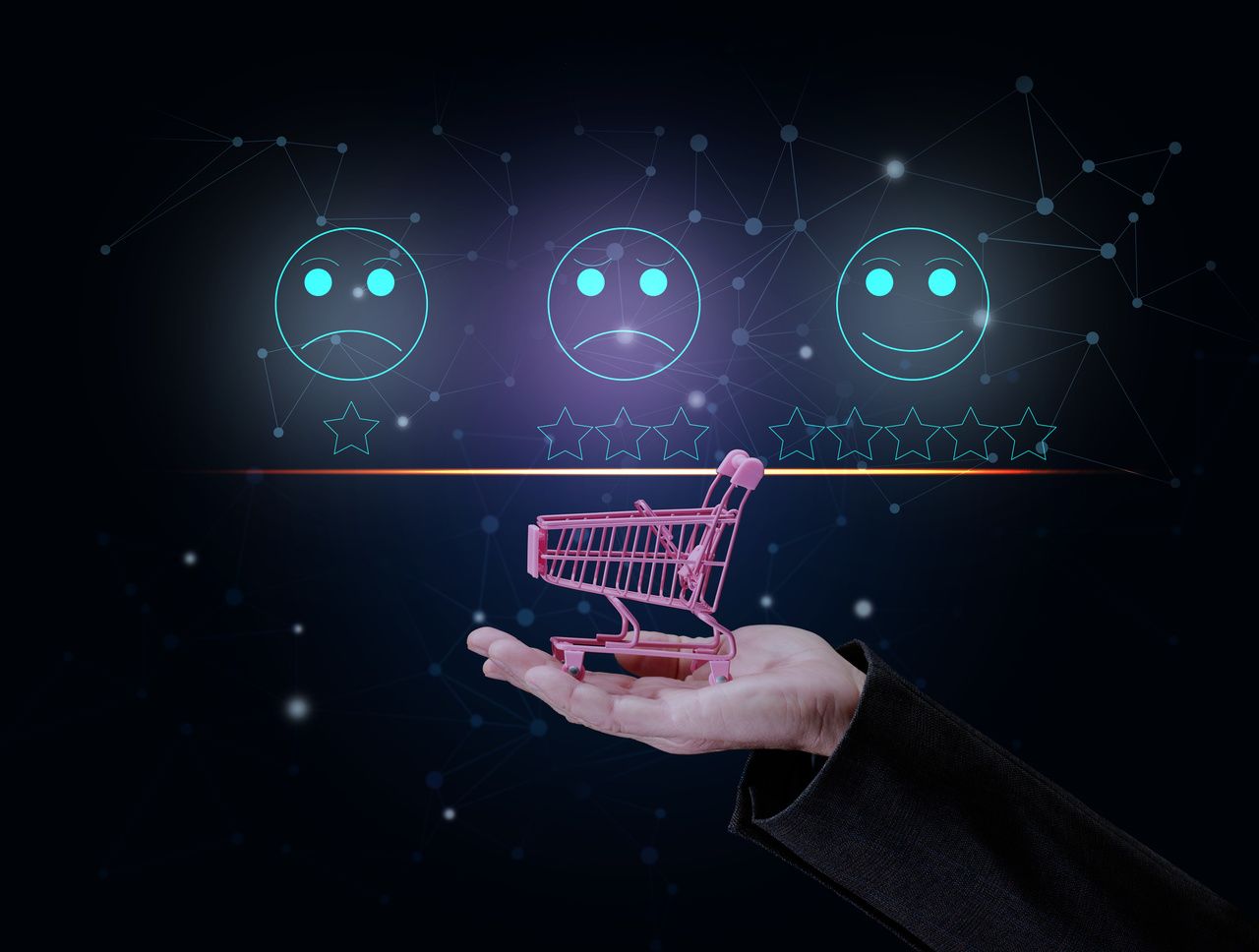 a hand holding a cart and the emojis from sad face to smiling face at the top on a shiny background