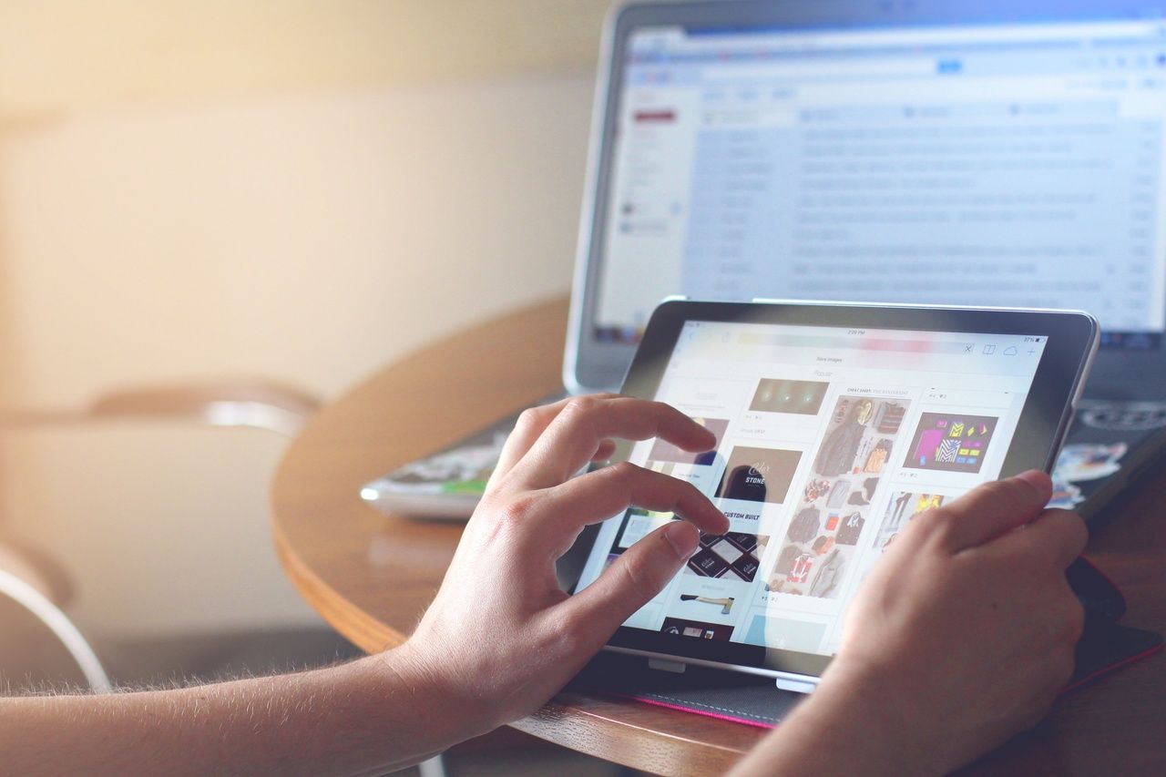 a person examining the tool on the tablet