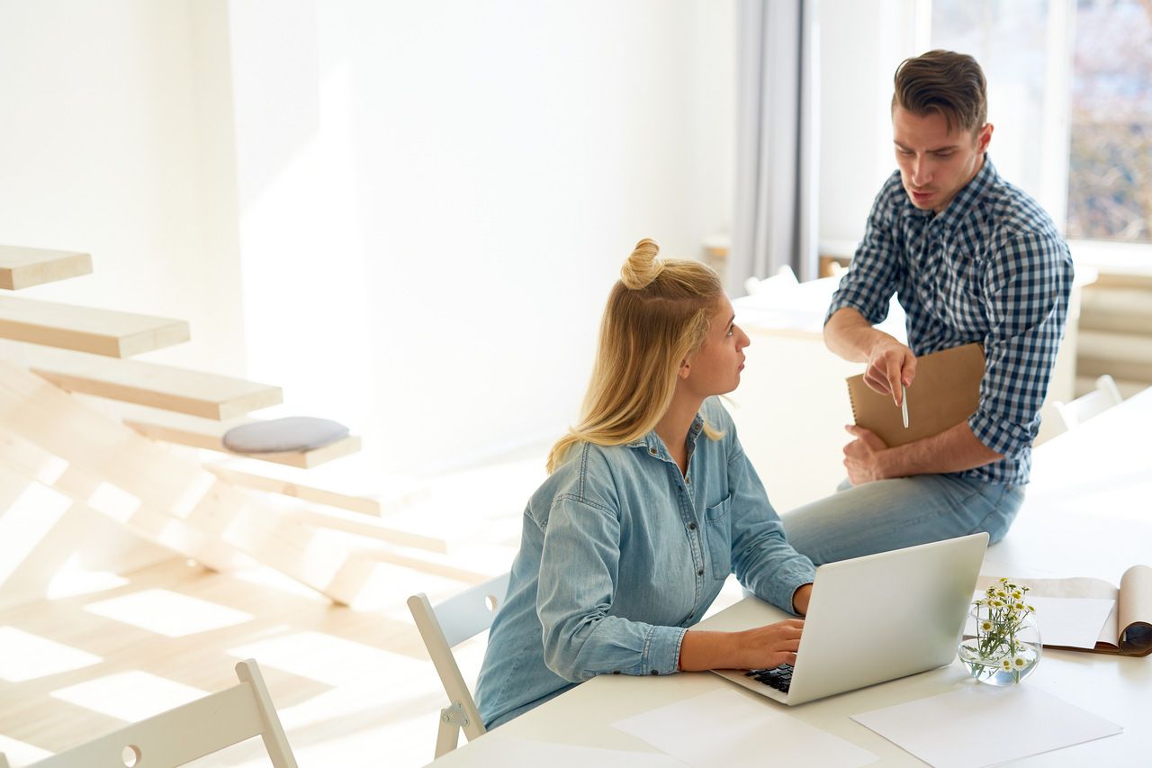 a man and a woman discussing design trends