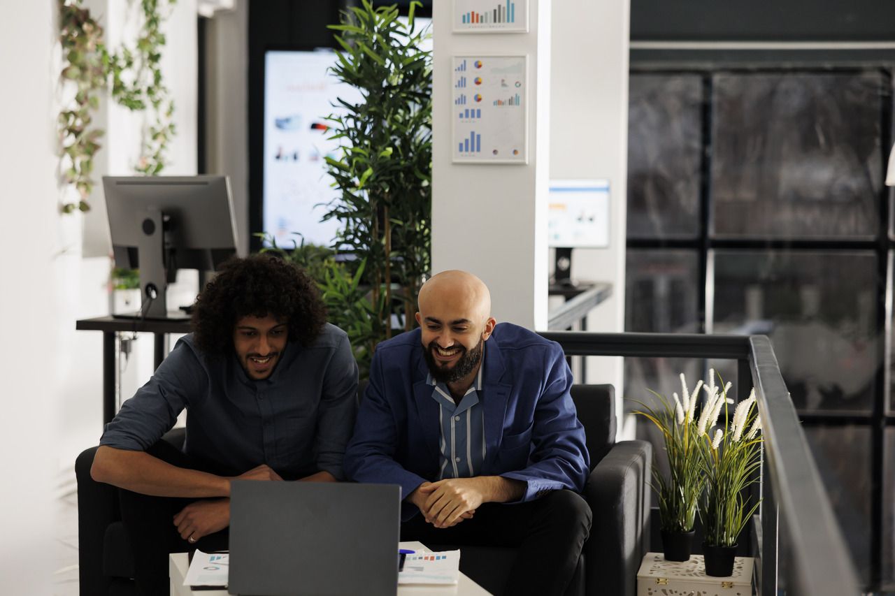 two colleagues checking and following the rates of business